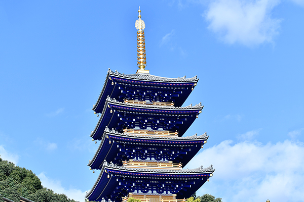 The reconstructed five-story pagoda is painted bright blue